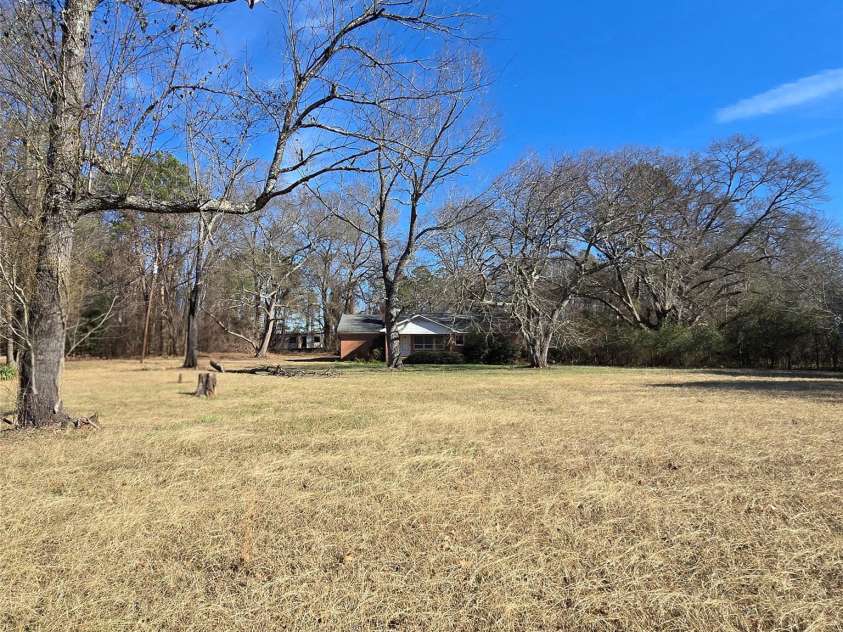 5323 New Hope Road, Belmont, NC 28012.  MLS# CAR4338697, YatesRealty ID 2986. Home from front of yard near S New Hope Rd