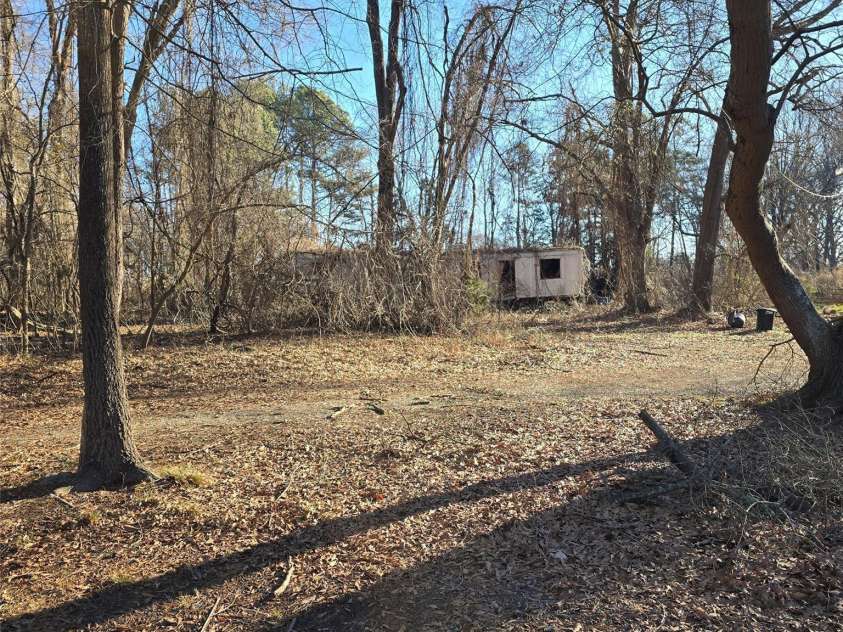 5323 New Hope Road, Belmont, NC 28012.  MLS# CAR4338697, YatesRealty ID 2986. OLD trailer that will remain - obviously not habitable 