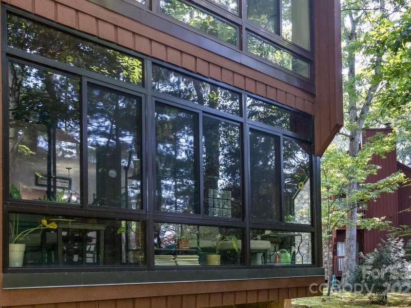 107 Cedar Forest Trail, Asheville, NC 28803.  MLS# CAR4276126, YatesRealty ID 29863. Enclosed sunroom / back porch