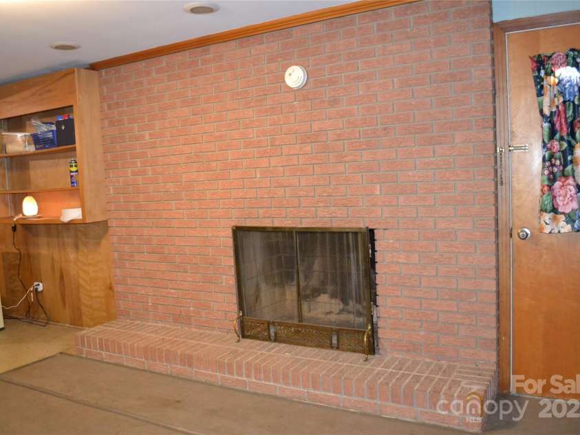 405 Wesley Heights Drive, Albemarle, NC 28001.  MLS# CAR4272842, YatesRealty ID 29875. Basement fireplace