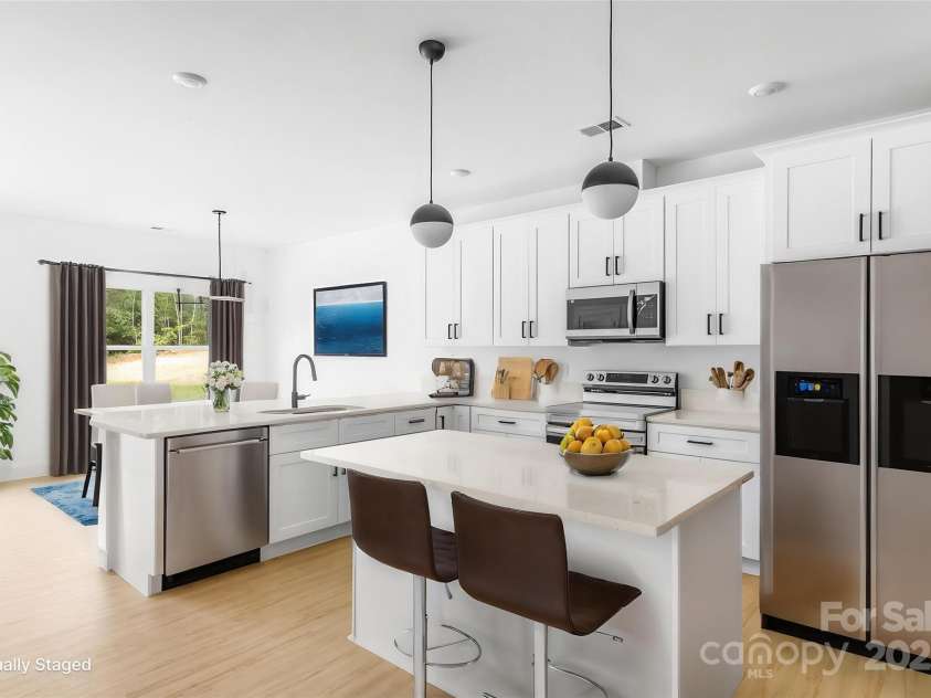 5125 Carden Drive, Charlotte, NC 28227.  MLS# CAR4250454, YatesRealty ID 29879. Kitchen- Dinning room Virtual Stage