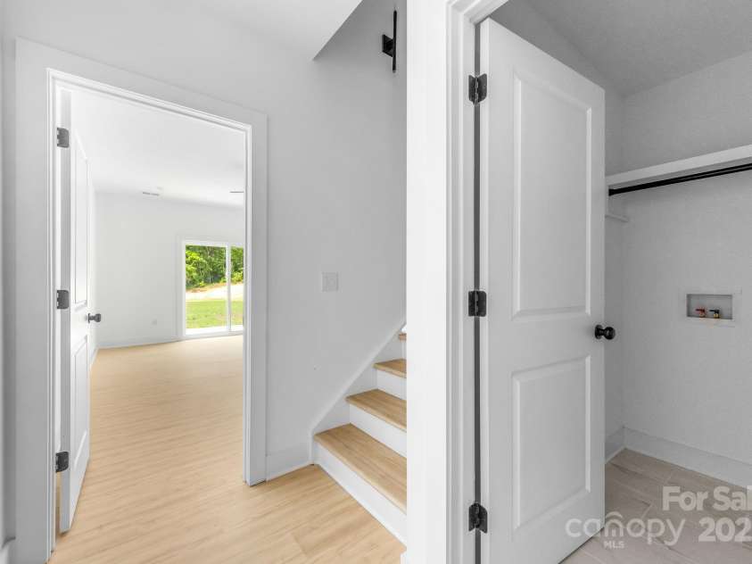 5125 Carden Drive, Charlotte, NC 28227.  MLS# CAR4250454, YatesRealty ID 29879. Laundry room / Primary Bedroom