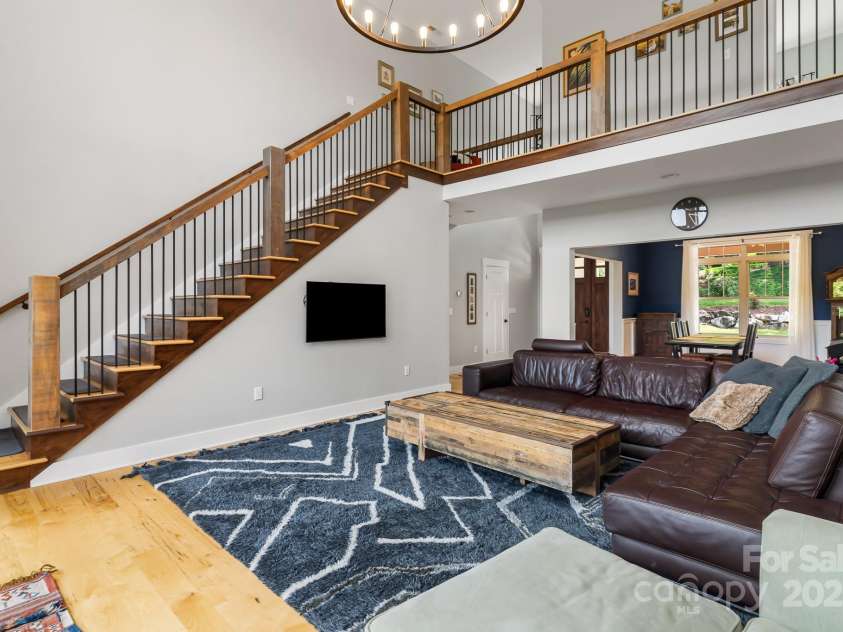 19 Carrolls Place Court, Mills River, NC 28759.  MLS# CAR4282064, YatesRealty ID 29890. A custom Cumaru Brazilian teak banister leads to the 2nd level