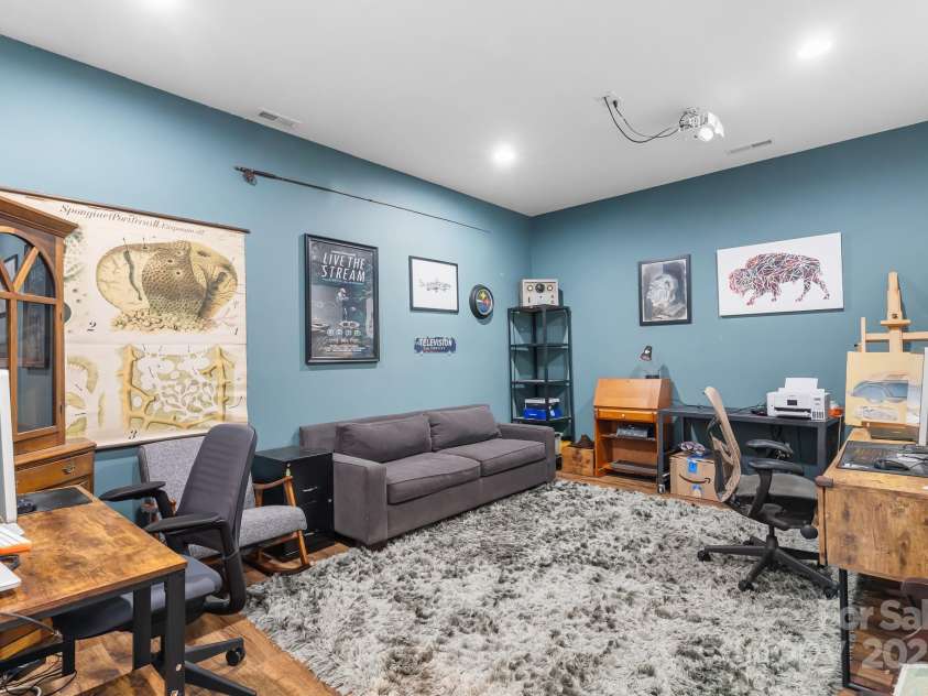 19 Carrolls Place Court, Mills River, NC 28759.  MLS# CAR4282064, YatesRealty ID 29890. Basement office with projector - could be turned into a movie room