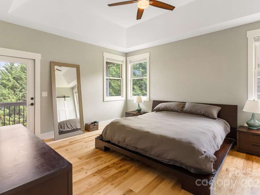 19 Carrolls Place Court, Mills River, NC 28759.  MLS# CAR4282064, YatesRealty ID 29890. Primary bedroom with private covered deck