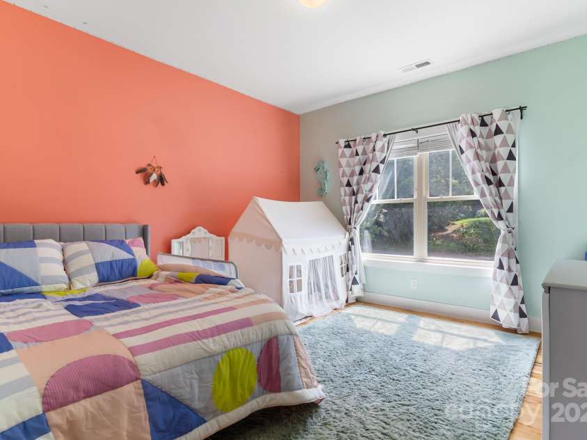 19 Carrolls Place Court, Mills River, NC 28759.  MLS# CAR4282064, YatesRealty ID 29890. Upstairs bedroom 01 with walk-in closet