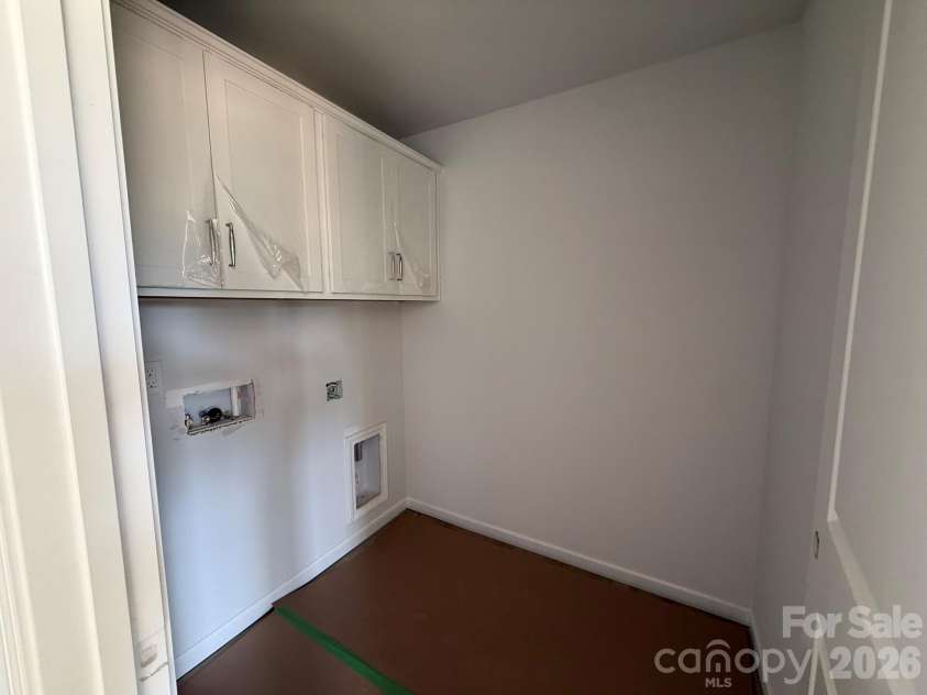 4021 Juno Drive, Charlotte, NC 28215.  MLS# CAR4392670, YatesRealty ID 29893. Laundry Room with Cabinets for extra storage
