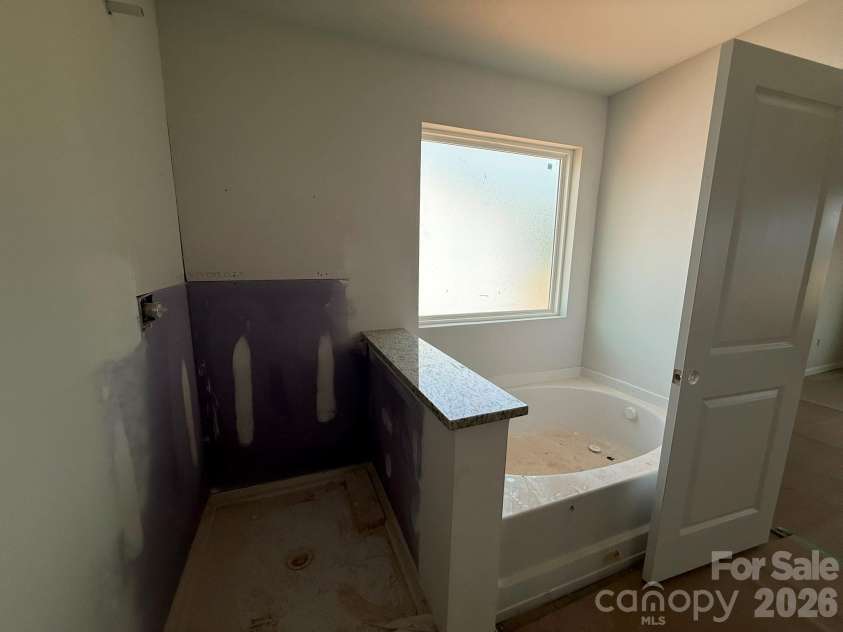 4021 Juno Drive, Charlotte, NC 28215.  MLS# CAR4392670, YatesRealty ID 29893. Primary bath will feature garden tub and tile shower