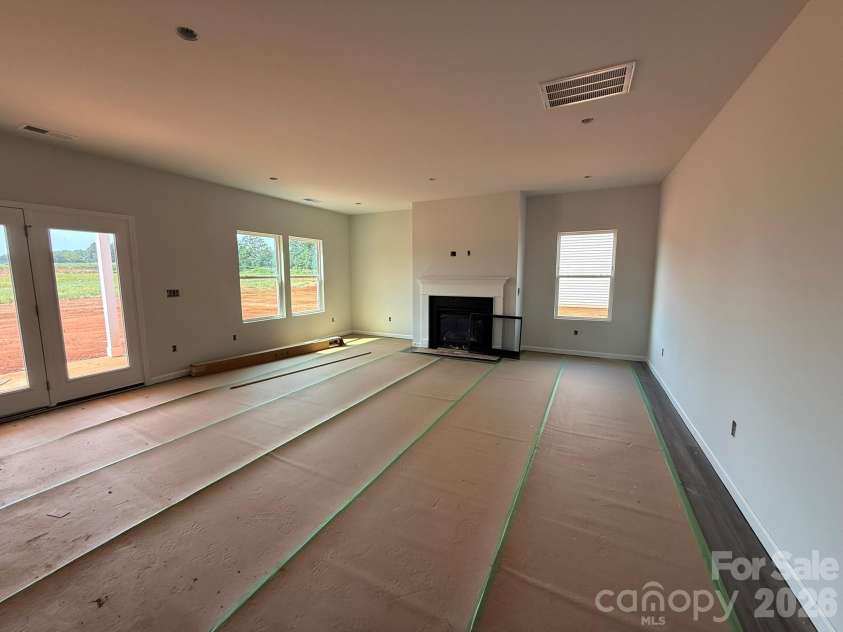 4017 Juno Drive, Charlotte, NC 28215.  MLS# CAR4392598, YatesRealty ID 29895. Spacious Family Room with Fireplace can be seen