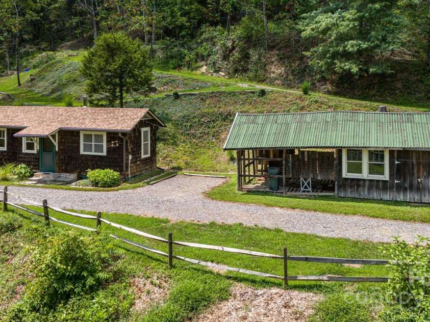 92 Hamburg Mountain Road, Weaverville, NC 28787.  MLS# CAR4285985, YatesRealty ID 29895. Cabin and packing shed