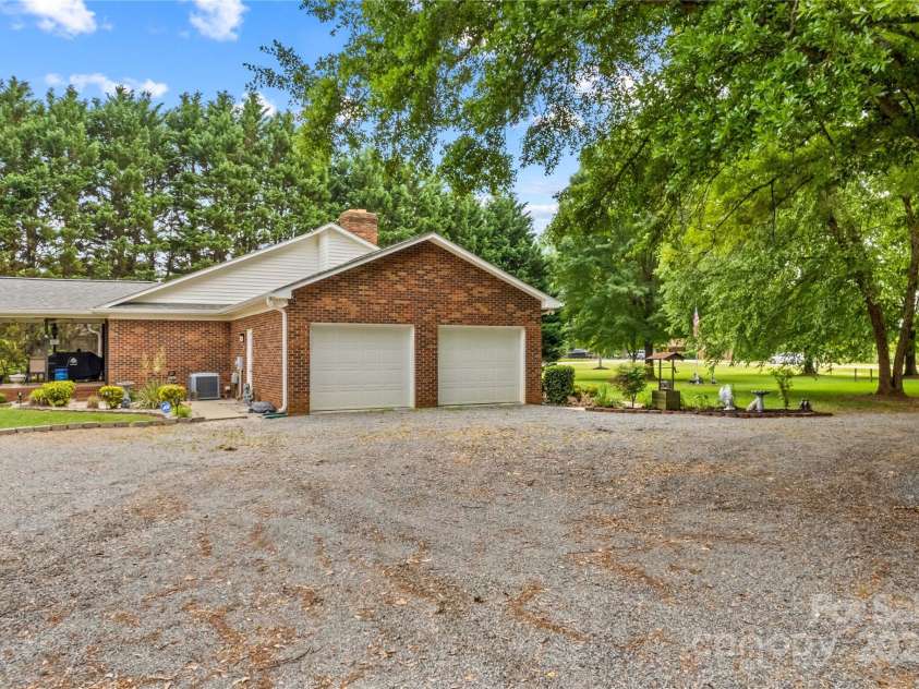 648 Odell School Road, Concord, NC 28027.  MLS# CAR4260231, YatesRealty ID 29897. 2 Car side load garage