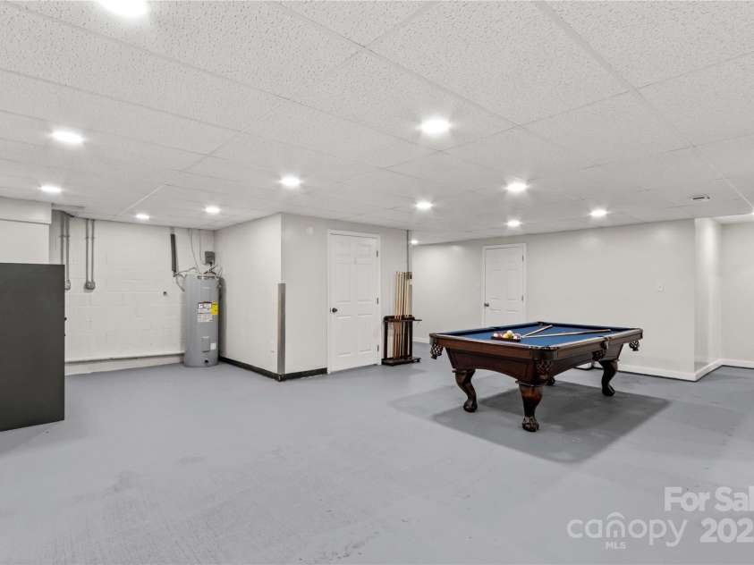 648 Odell School Road, Concord, NC 28027.  MLS# CAR4260231, YatesRealty ID 29897. Basement billiards room/bonus room