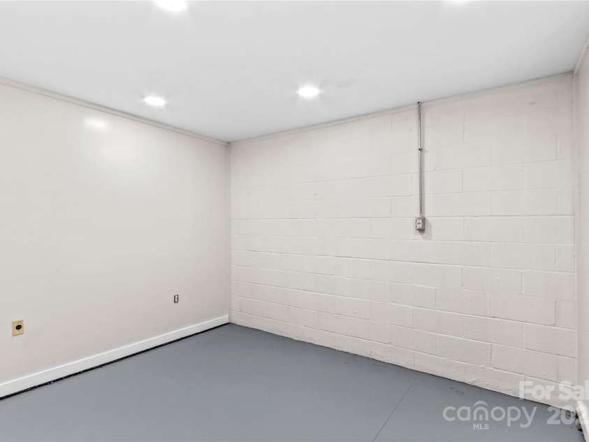 648 Odell School Road, Concord, NC 28027.  MLS# CAR4260231, YatesRealty ID 29897. Basement flex room 1