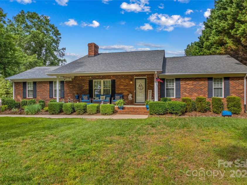648 Odell School Road, Concord, NC 28027.  MLS# CAR4260231, YatesRealty ID 29897. Cover porch