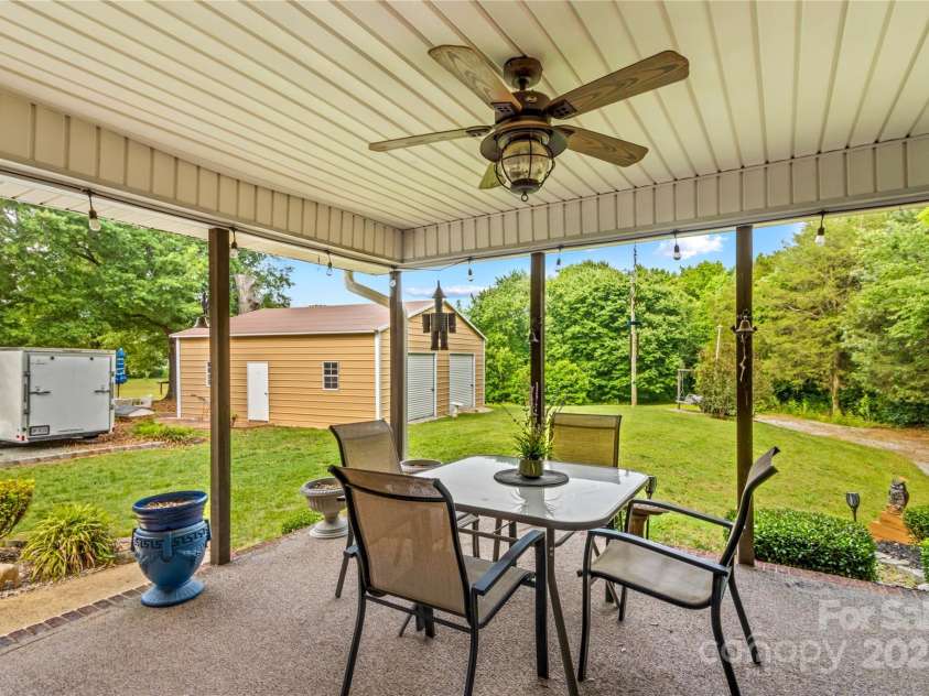 648 Odell School Road, Concord, NC 28027.  MLS# CAR4260231, YatesRealty ID 29897. Covered back porch