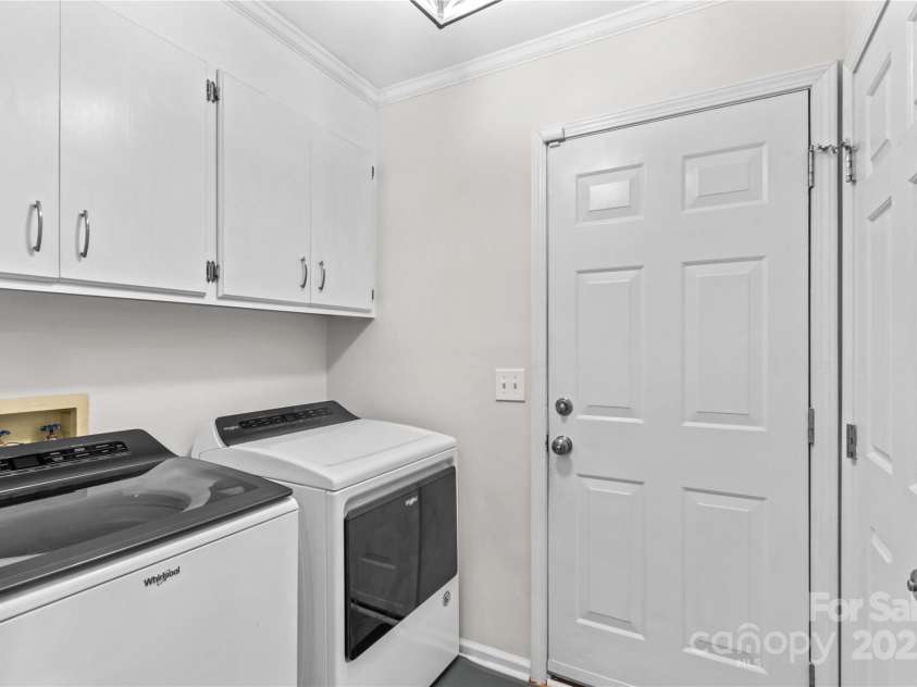 648 Odell School Road, Concord, NC 28027.  MLS# CAR4260231, YatesRealty ID 29897. Laundry room