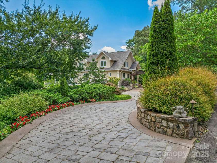 212 Plains Drive, Asheville, NC 28803.  MLS# CAR4284711, YatesRealty ID 29898. Amazing stone drive to welcome everyone