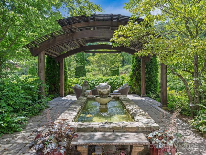 212 Plains Drive, Asheville, NC 28803.  MLS# CAR4284711, YatesRealty ID 29898. Beautiful terrace level fountain and gazebo