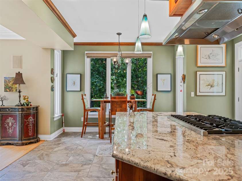 212 Plains Drive, Asheville, NC 28803.  MLS# CAR4284711, YatesRealty ID 29898. Breakfast nook overlooking nature