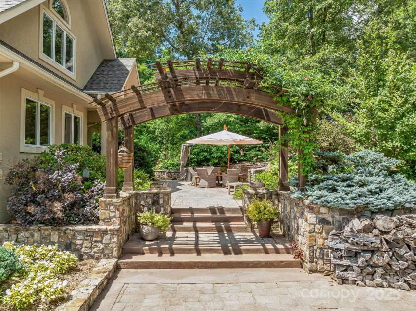 212 Plains Drive, Asheville, NC 28803.  MLS# CAR4284711, YatesRealty ID 29898. Front of home entertaining