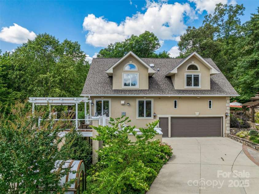 212 Plains Drive, Asheville, NC 28803.  MLS# CAR4284711, YatesRealty ID 29898. Greenhouse and multiple, inviting decks