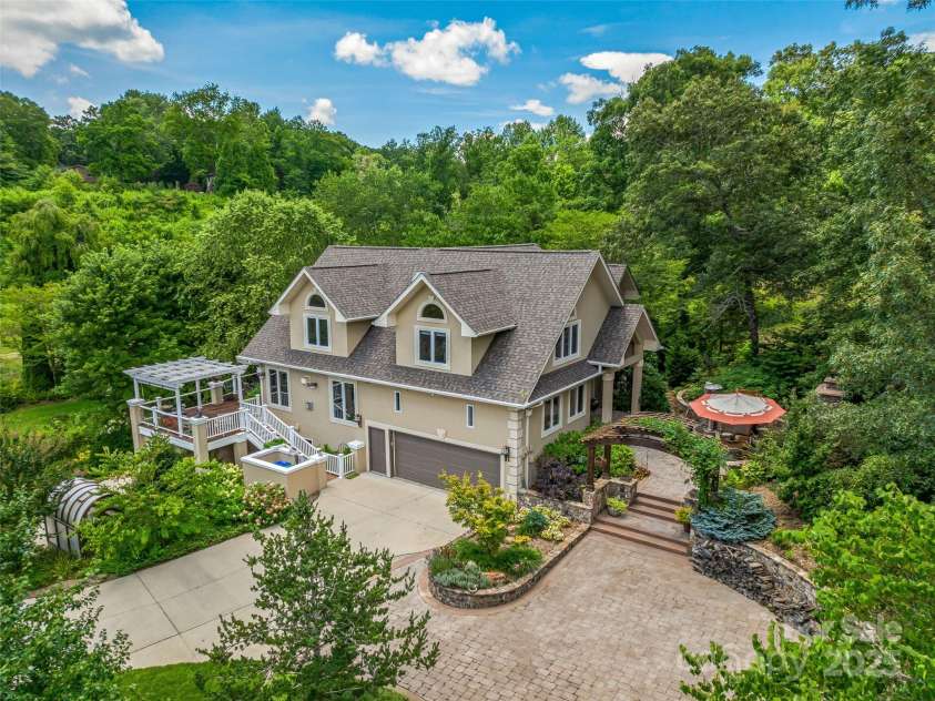 212 Plains Drive, Asheville, NC 28803.  MLS# CAR4284711, YatesRealty ID 29898. Lush landscaping abounds