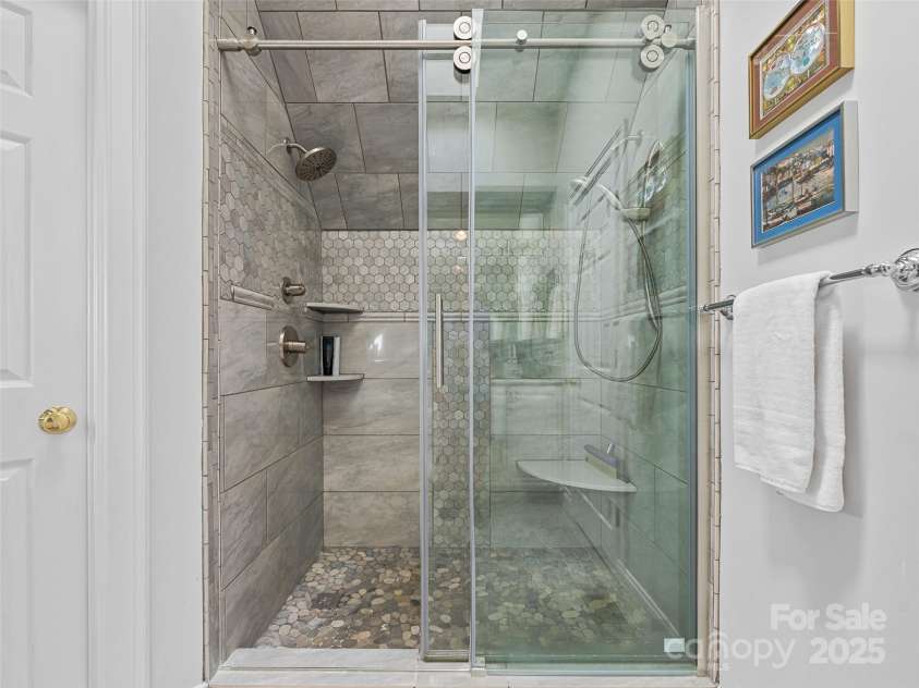212 Plains Drive, Asheville, NC 28803.  MLS# CAR4284711, YatesRealty ID 29898. Magnificent stone and tile shower in second level guest bath