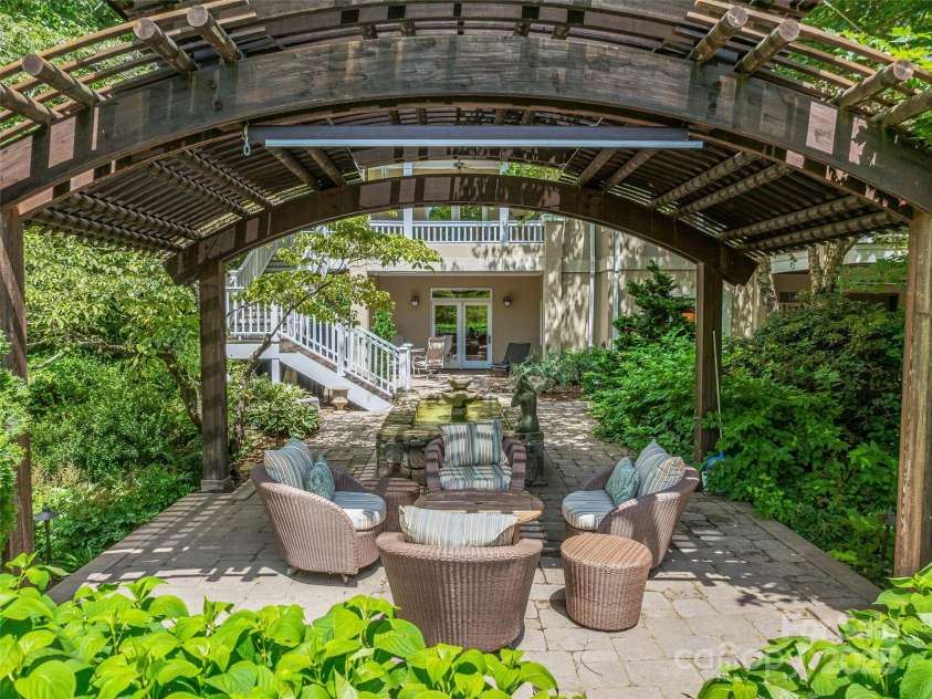 212 Plains Drive, Asheville, NC 28803.  MLS# CAR4284711, YatesRealty ID 29898. Terrace level patio with fountain