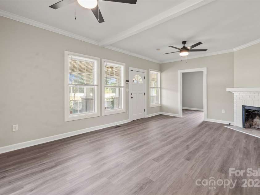 406 Main Street, Clover, SC 29710.  MLS# CAR4279553, YatesRealty ID 29899. Main living area with two lighted ceiling fans