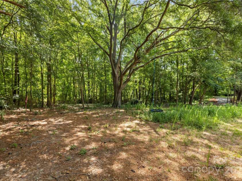 406 Main Street, Clover, SC 29710.  MLS# CAR4279553, YatesRealty ID 29899. Tree lined backyard providing shady spots