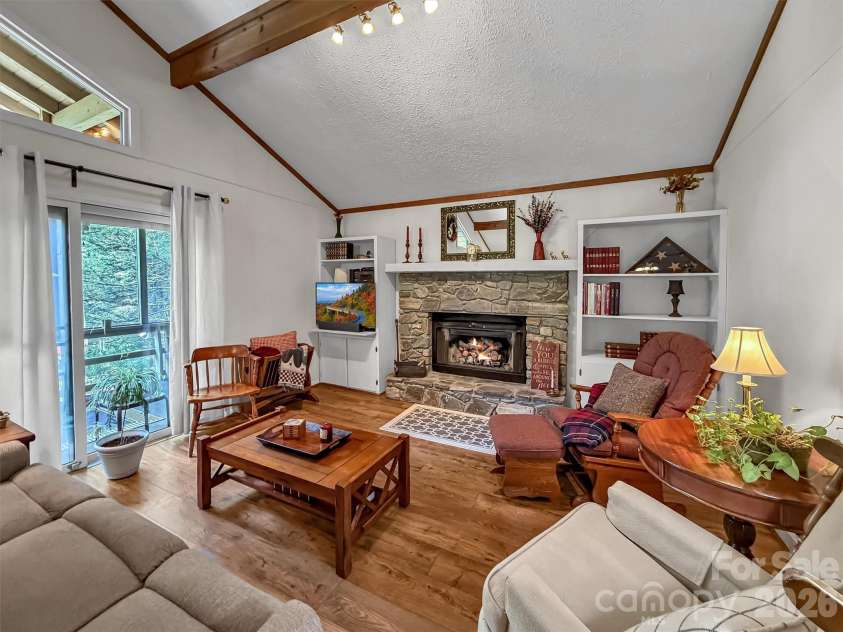 72 Sanctuary Road, Maggie Valley, NC 28751.  MLS# CAR4387632, YatesRealty ID 29910. GREAT ROOM WITH ACCESS TO SCREENED PORCH