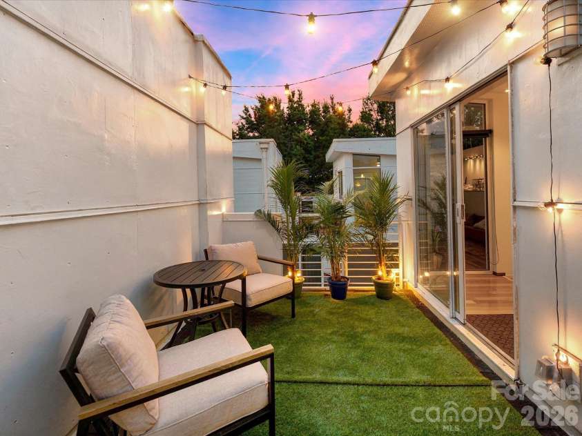 285 McDonald Avenue, Charlotte, NC 28203.  MLS# CAR4392788, YatesRealty ID 29915. Rooftop terrace at sunset