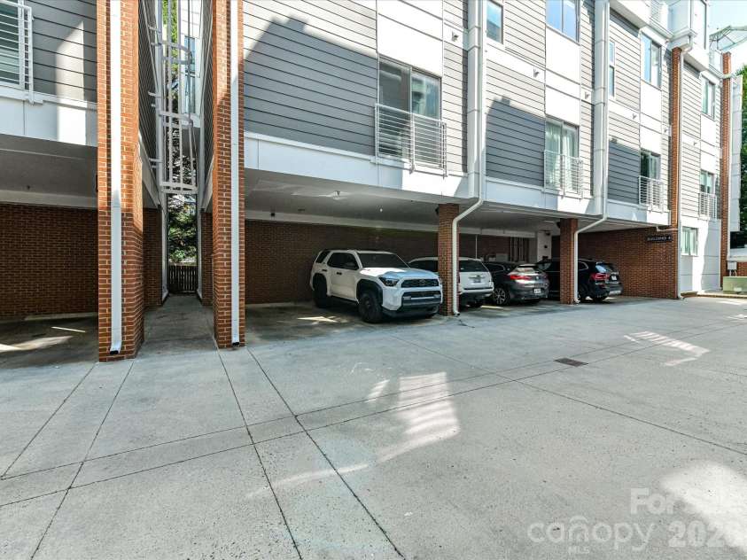 285 McDonald Avenue, Charlotte, NC 28203.  MLS# CAR4392788, YatesRealty ID 29915. The condo comes with two unassigned covered parking spots
