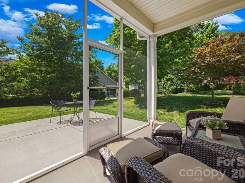 4232 Sourwood Court, Fort Mill, SC 29707.  MLS# CAR4376852, YatesRealty ID 29923. Rear outdoor seating area