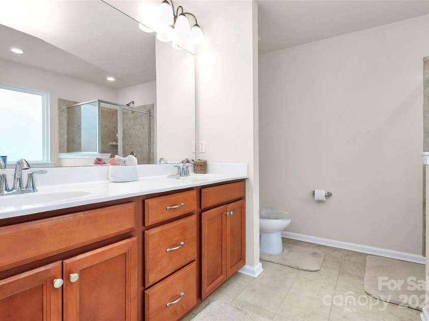 10369 Hillsborough Street, Huntersville, NC 28078.  MLS# CAR4283679, YatesRealty ID 29924. Dual vanity with tile flooring