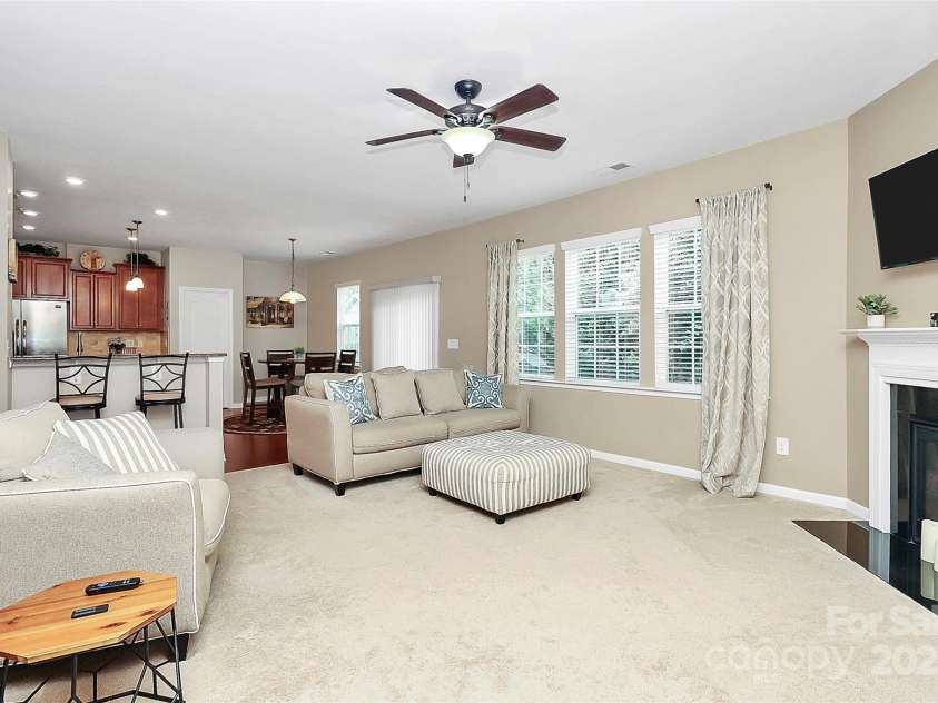 10369 Hillsborough Street, Huntersville, NC 28078.  MLS# CAR4283679, YatesRealty ID 29924. Gast fireplace with nice amount of windows and sliding doors
