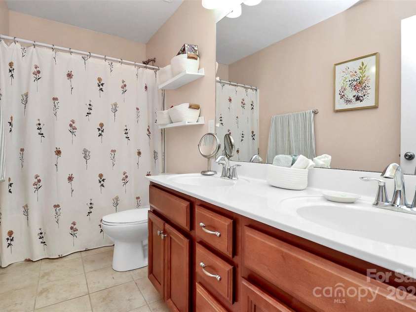 10369 Hillsborough Street, Huntersville, NC 28078.  MLS# CAR4283679, YatesRealty ID 29924. Guest bathroom with dual vanity.