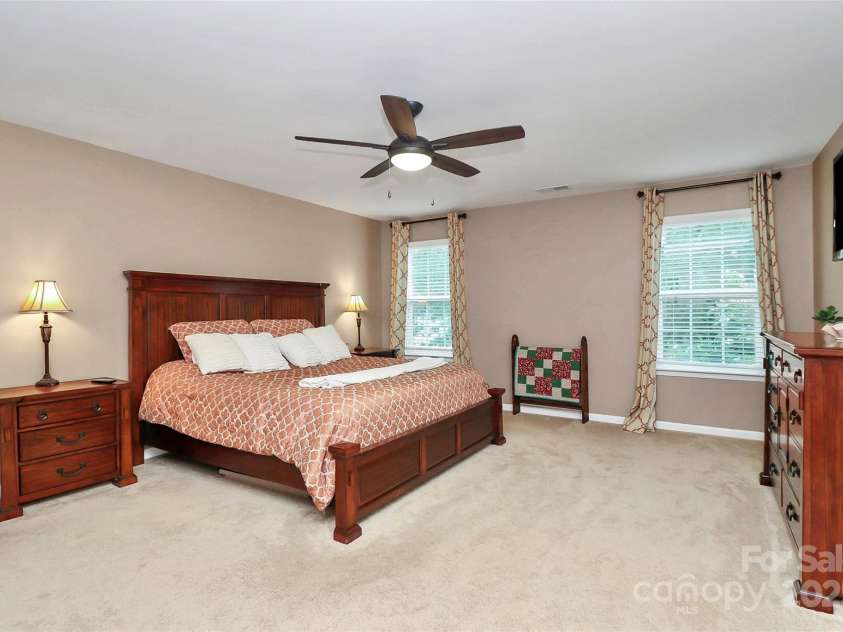 10369 Hillsborough Street, Huntersville, NC 28078.  MLS# CAR4283679, YatesRealty ID 29924. Huge primary overlooking backyard with ceiling fan
