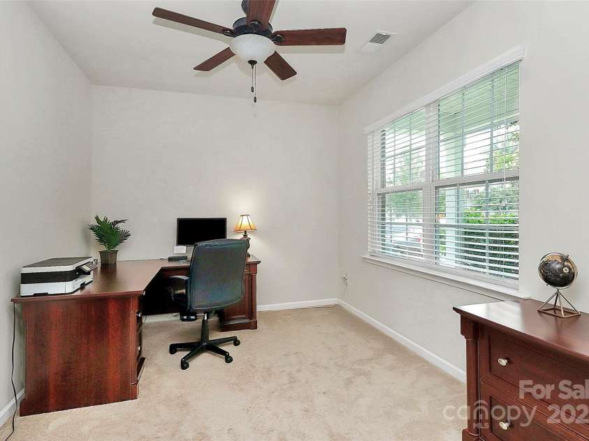 10369 Hillsborough Street, Huntersville, NC 28078.  MLS# CAR4283679, YatesRealty ID 29924. Office/den on main level located away from the main living for privacy