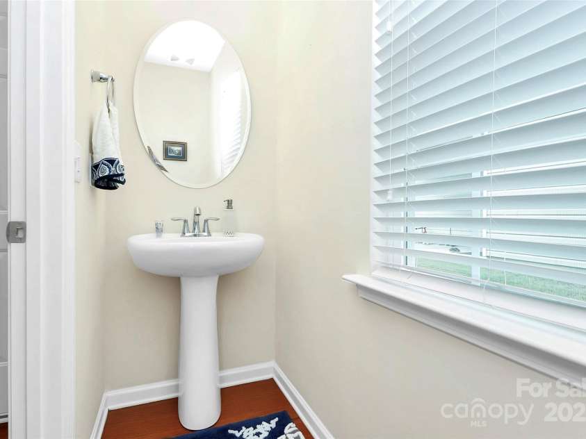 10369 Hillsborough Street, Huntersville, NC 28078.  MLS# CAR4283679, YatesRealty ID 29924. Powder room tucked away off kitchen for privacy