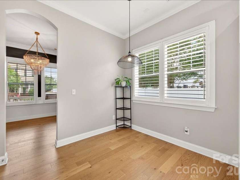 12422 Brenthaven Drive, Davidson, NC 28036.  MLS# CAR4387323, YatesRealty ID 29933. Breakfast area with plantation shutters with access to dining room.