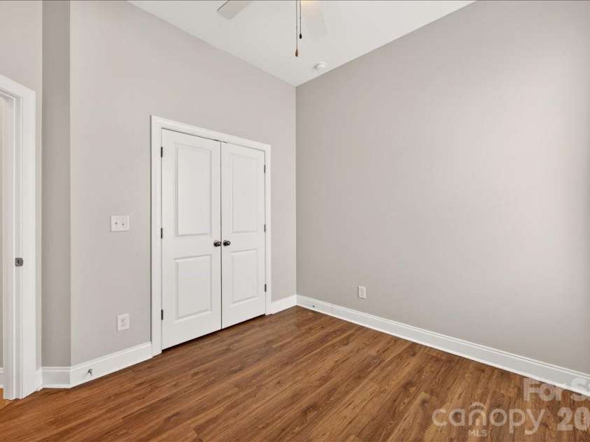 12422 Brenthaven Drive, Davidson, NC 28036.  MLS# CAR4387323, YatesRealty ID 29933. Guest bedroom #1 on main floor.