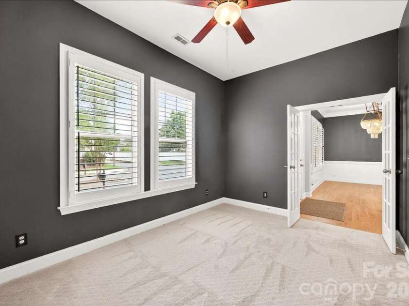 12422 Brenthaven Drive, Davidson, NC 28036.  MLS# CAR4387323, YatesRealty ID 29933. Office/study looking into entry and dining room.
