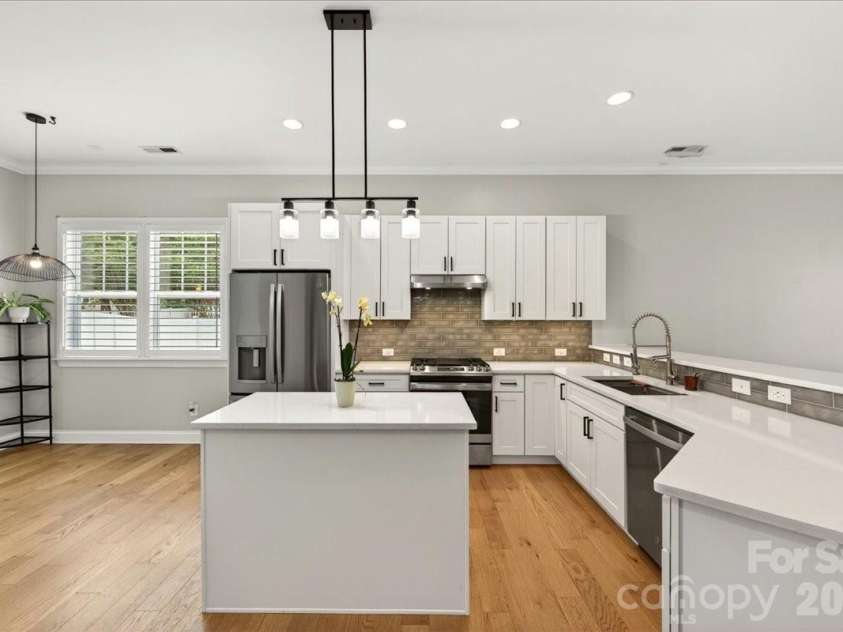 12422 Brenthaven Drive, Davidson, NC 28036.  MLS# CAR4387323, YatesRealty ID 29933. Updated kitchen with new cabinets and quartz countertops.