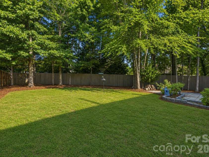 9420 Kestral Ridge Drive, Charlotte, NC 28269.  MLS# CAR4392710, YatesRealty ID 29945. Virtual Update-Pine Needles and backyard