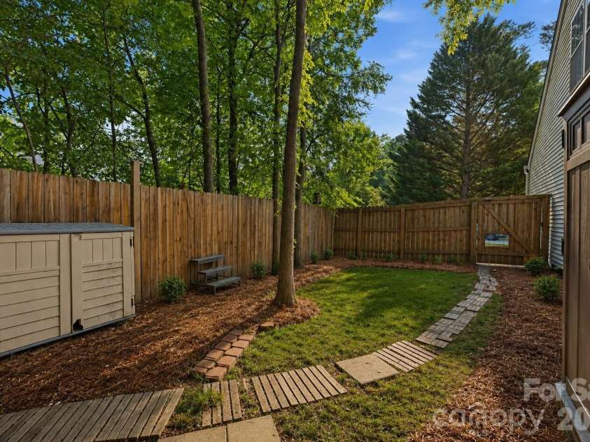 9420 Kestral Ridge Drive, Charlotte, NC 28269.  MLS# CAR4392710, YatesRealty ID 29945. Virtual Update-Pine Needles and backyard