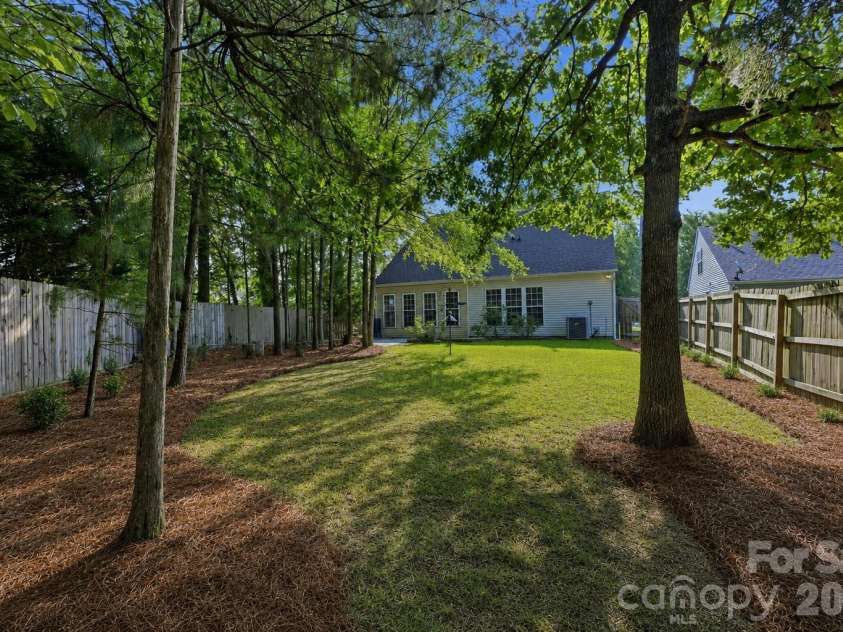 9420 Kestral Ridge Drive, Charlotte, NC 28269.  MLS# CAR4392710, YatesRealty ID 29945. Virtual Update-Pine Needles and backyard