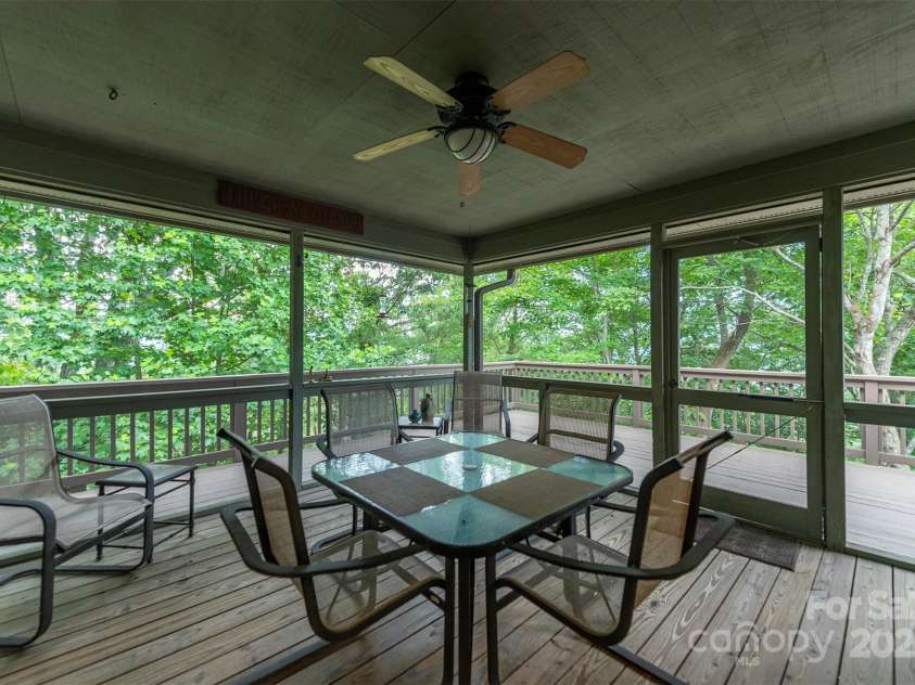 4 Galax Lane, Black Mountain, NC 28711.  MLS# CAR4286030, YatesRealty ID 29947. 3-season screened porch to wrap around deck