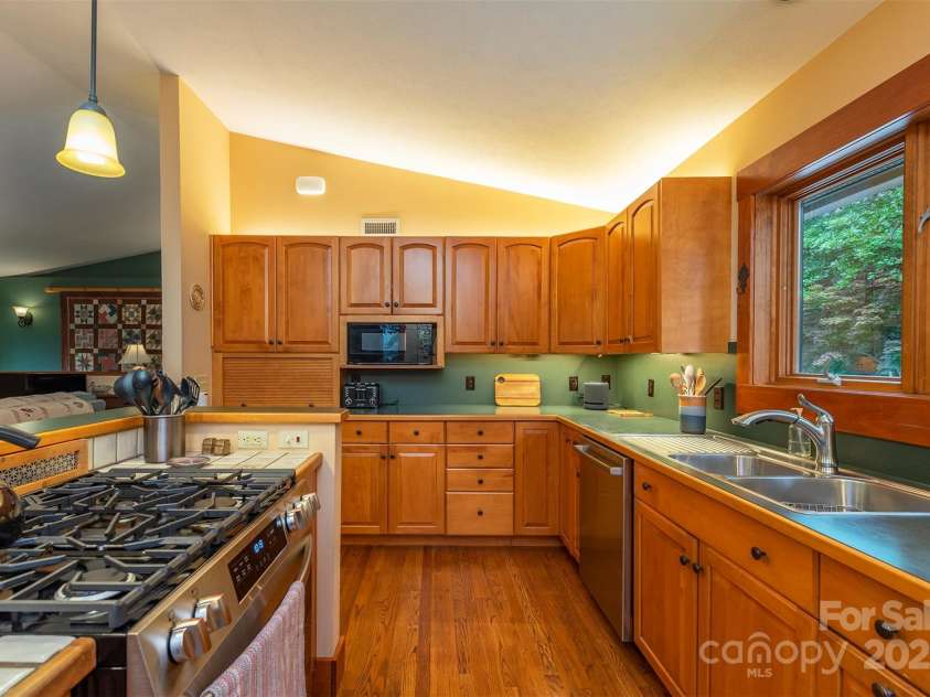 4 Galax Lane, Black Mountain, NC 28711.  MLS# CAR4286030, YatesRealty ID 29947. Beautiful custom wood cabinetry by local craftsman.