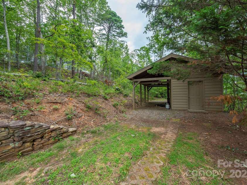 4 Galax Lane, Black Mountain, NC 28711.  MLS# CAR4286030, YatesRealty ID 29947. Shed/carport, tucked away w/level driveway
